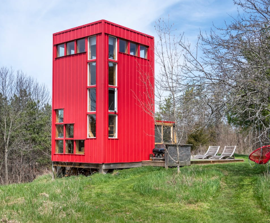 red container house in the woods